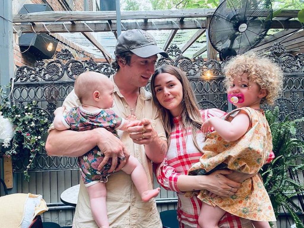 Addison And Jeremy holding their each kids