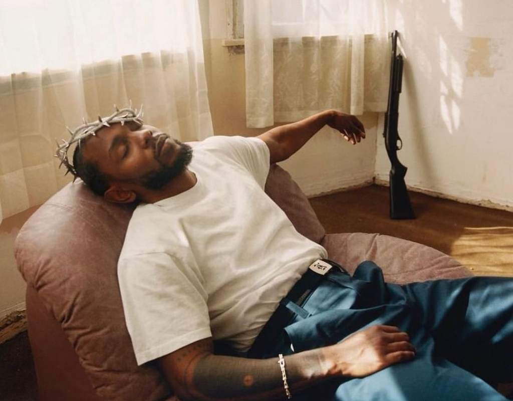Kendrick Lamar getting pictured while taking a nap on set.