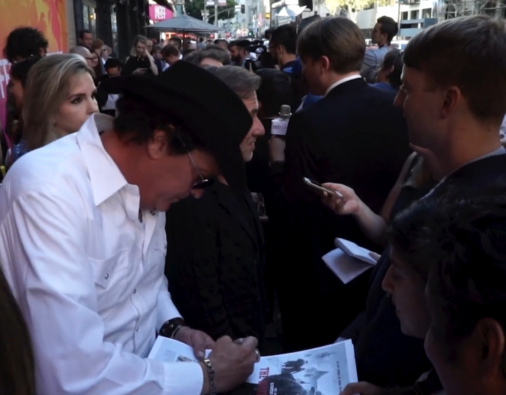 Michael Madsen giving a fan his autograph