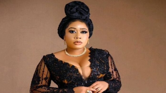 Moyo Lawal in Black dress and white neckless
