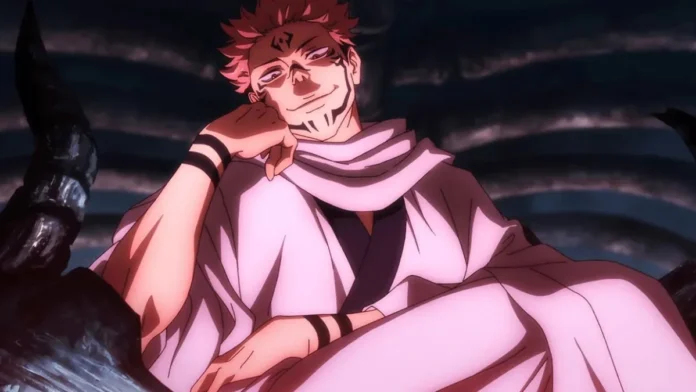 Sukuna sitting with hand in his face and smiling