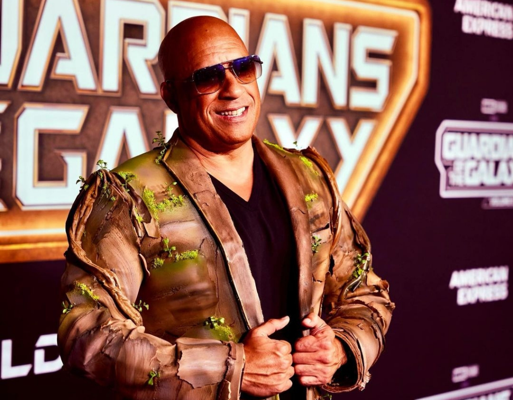 Vin Diesel wearing a costume that portrays his character as Groot.