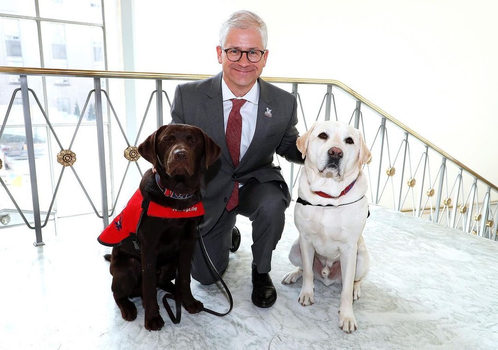 Patrick Mchenry with 2 vet dogs
