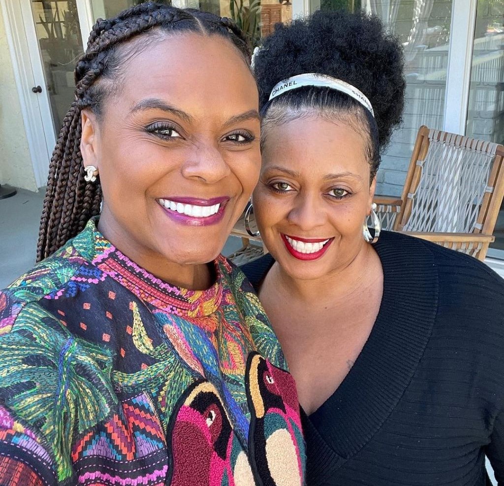 A smiling picture of Tabitha Brown with her sister Tasha.