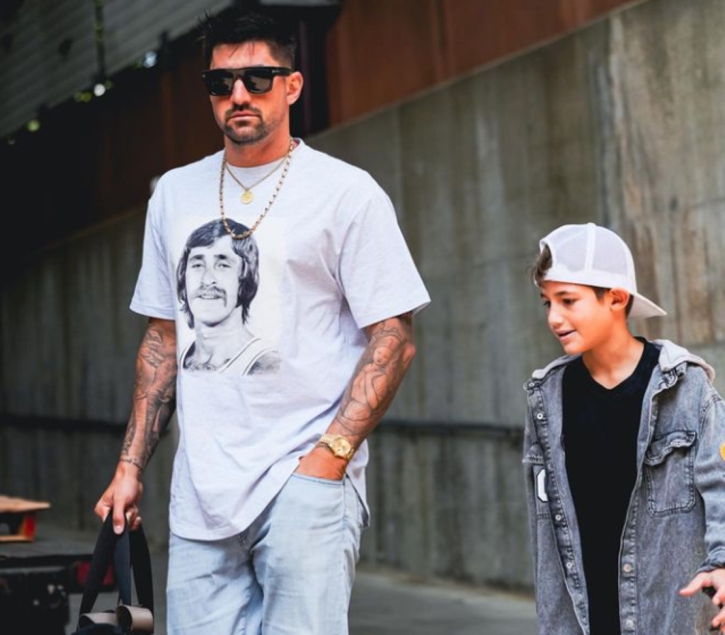 Nick walks with son Liam Castellanos