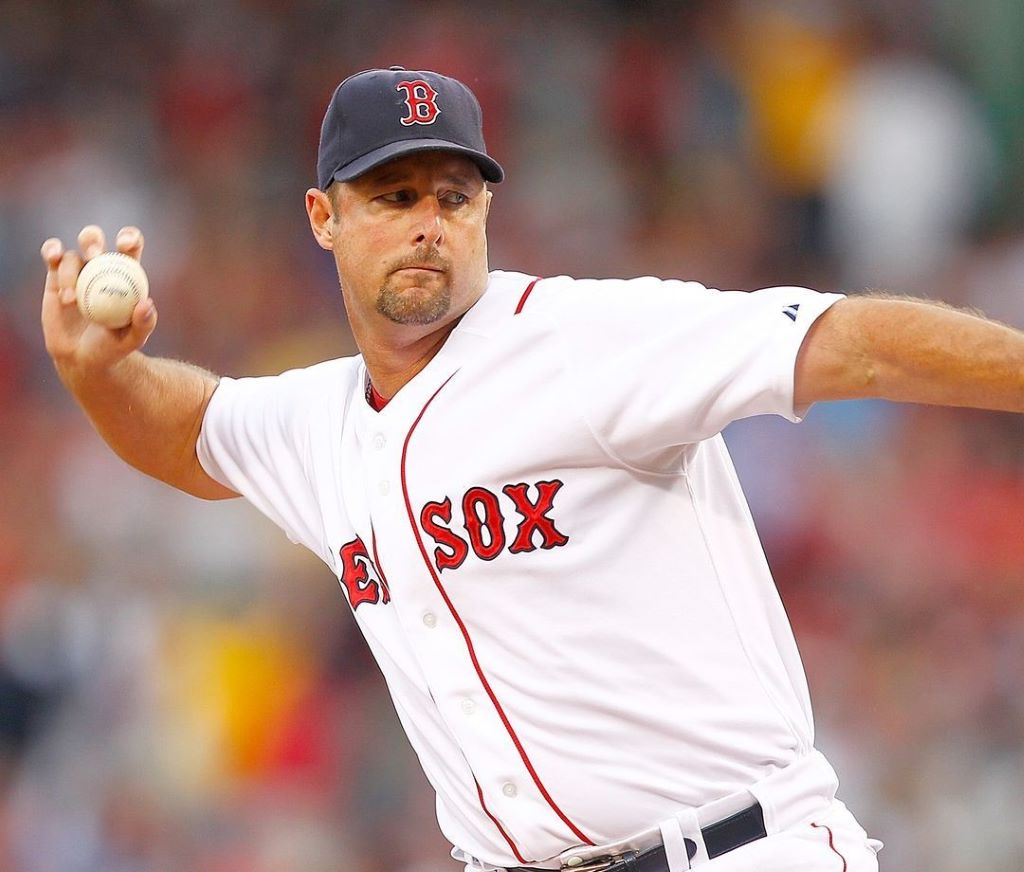 Tim Wakefield tattoo free arm with baseball in hand 