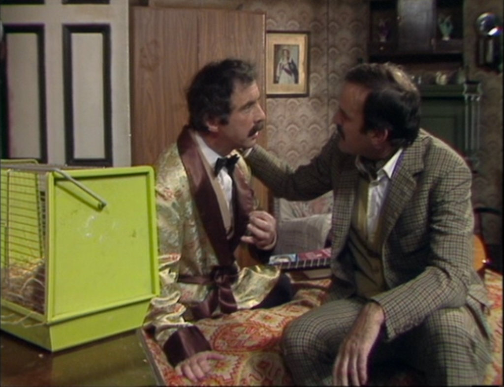 Two person talking with one another Fawlty Towers, “The Anniversary” and “Basil the Rat”