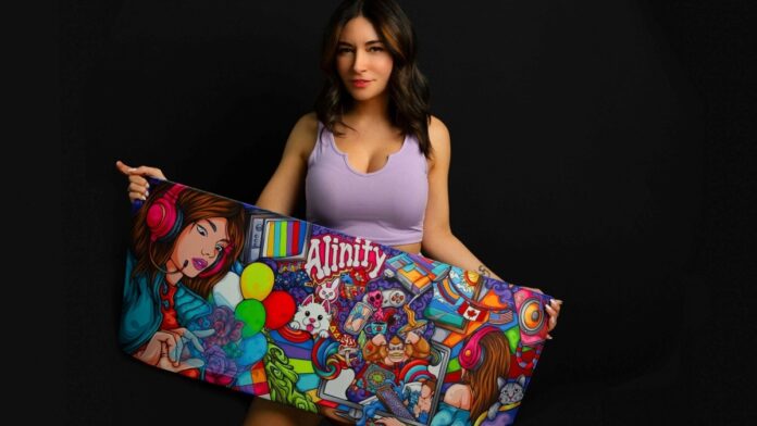 Alinity holding her deskmats.