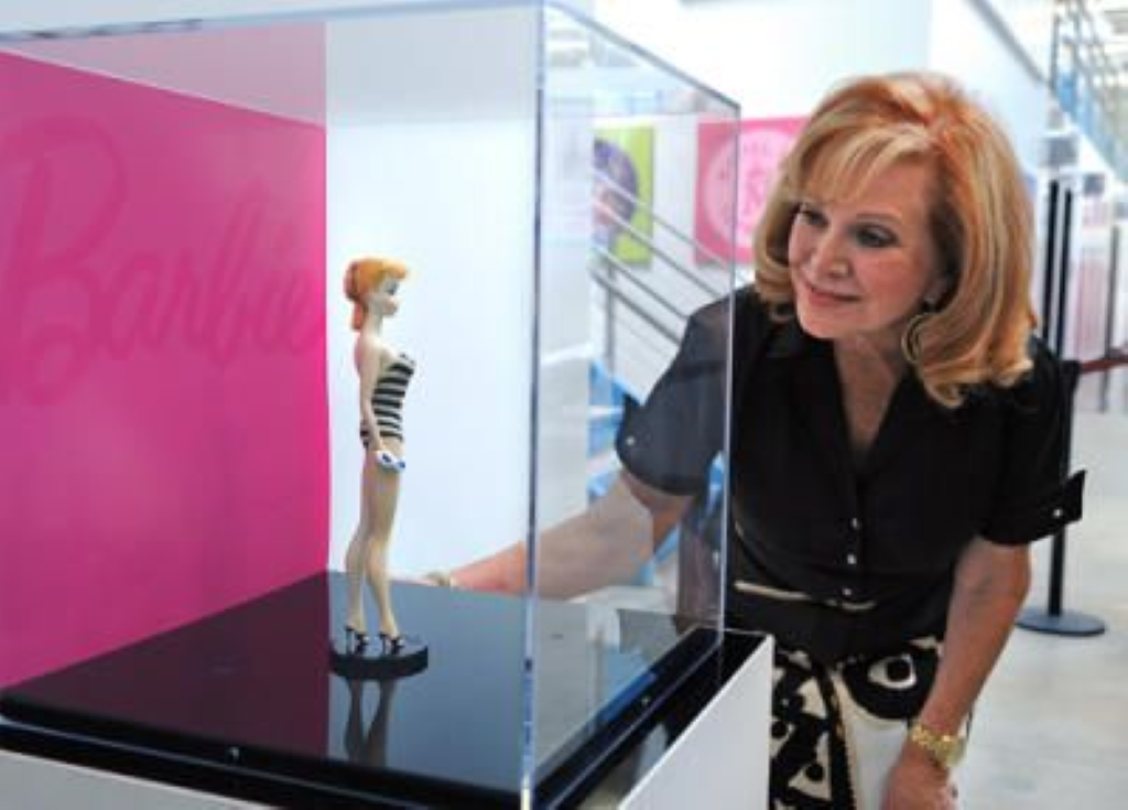 Barbara looking at the first Barbie doll.
