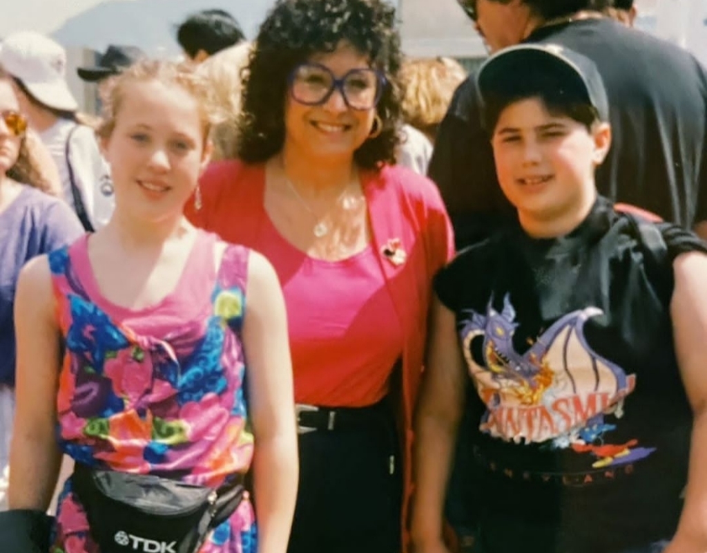Adam Ray and his sister with their mom on a trip to Disneyland