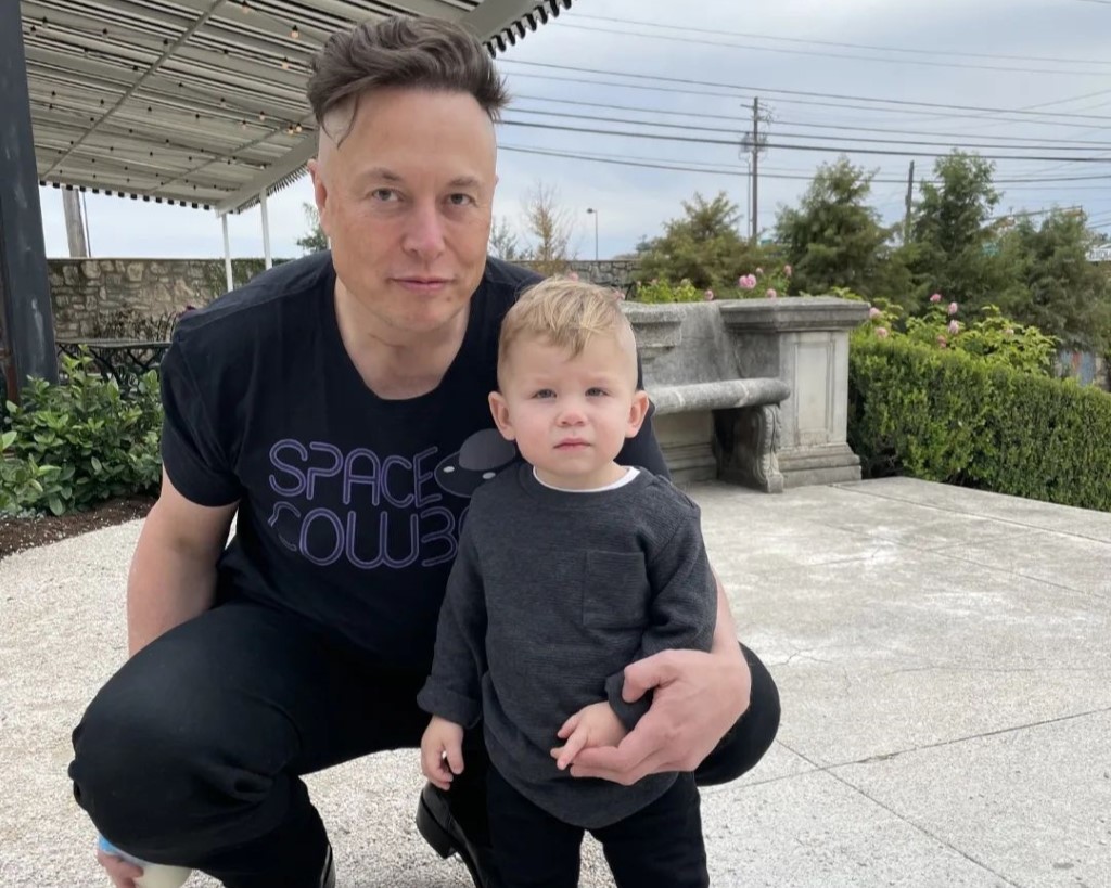 Elon Musk along with a kid.
