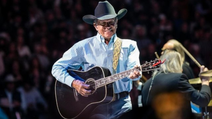 George Strait is not dead and alive giving hits after hits performances in stage.