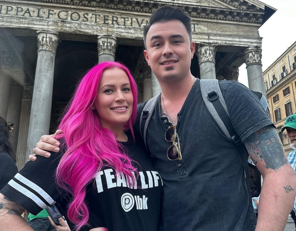 Lindsay Boreing taking a picture with her husband while traveling to Italy