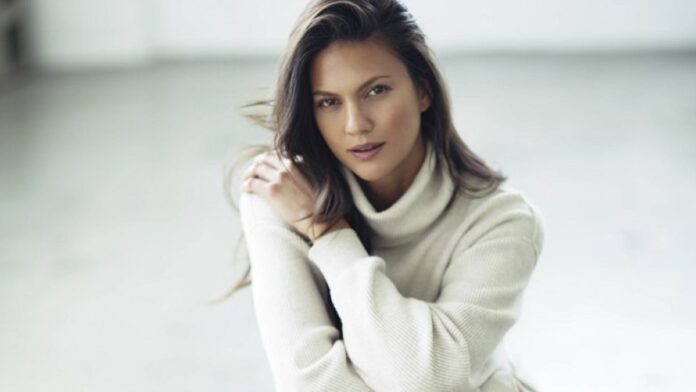 Megan in a white sweater.