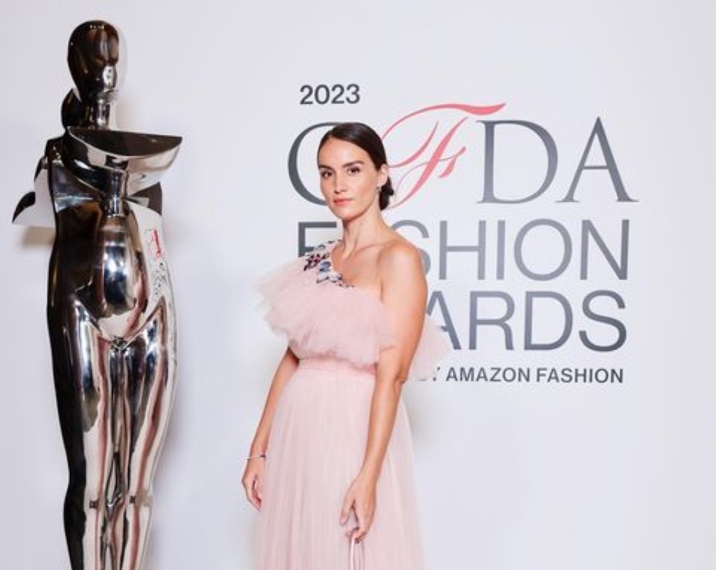 Chloe's picture at the fashion award show in a pinkish dress.