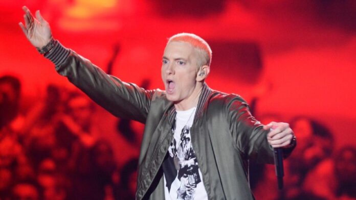 Eminem holding on stage with mic