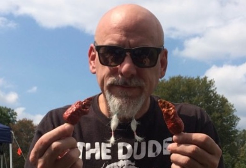 Johnny Scoville holding chili in his hands