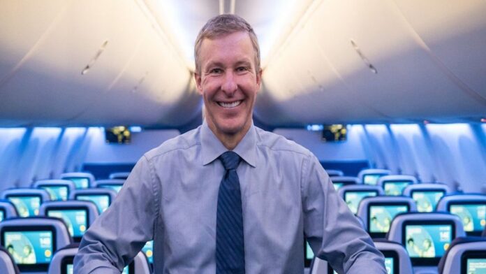 Scott Kirby pictured smiling inside plane