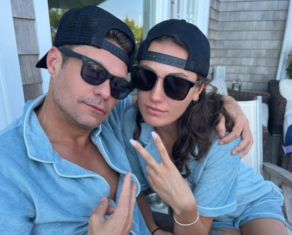 Ryan and Aubrey spotted in matching outfits, wearing the same color dress, cap, and goggles.