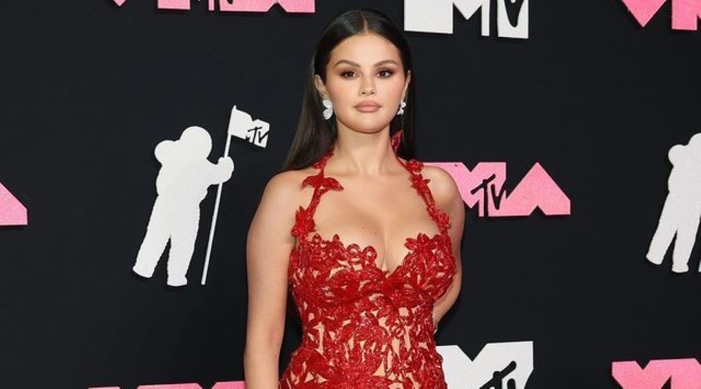 Selena looking stunning in a red outfit seen at the MTV premiere. 