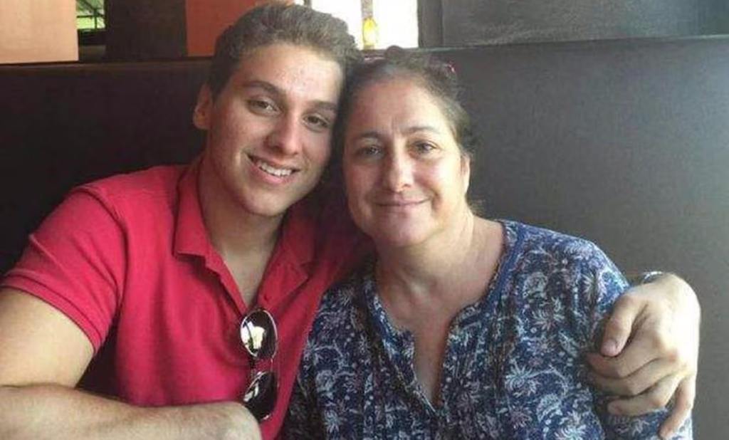 Austin with his beloved mom on their restaurant.