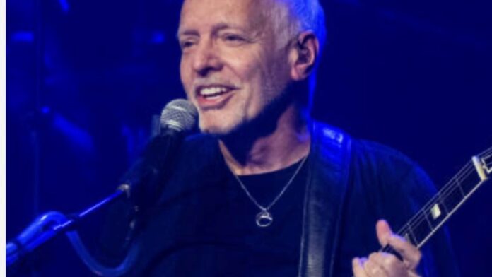 Peter Frampton with a mic and guitar