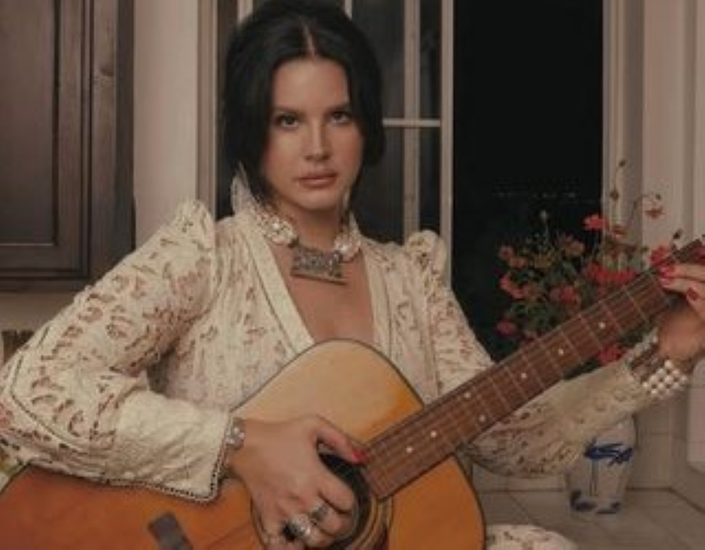 Lana practicing guitar for her role in new release song of 2023.